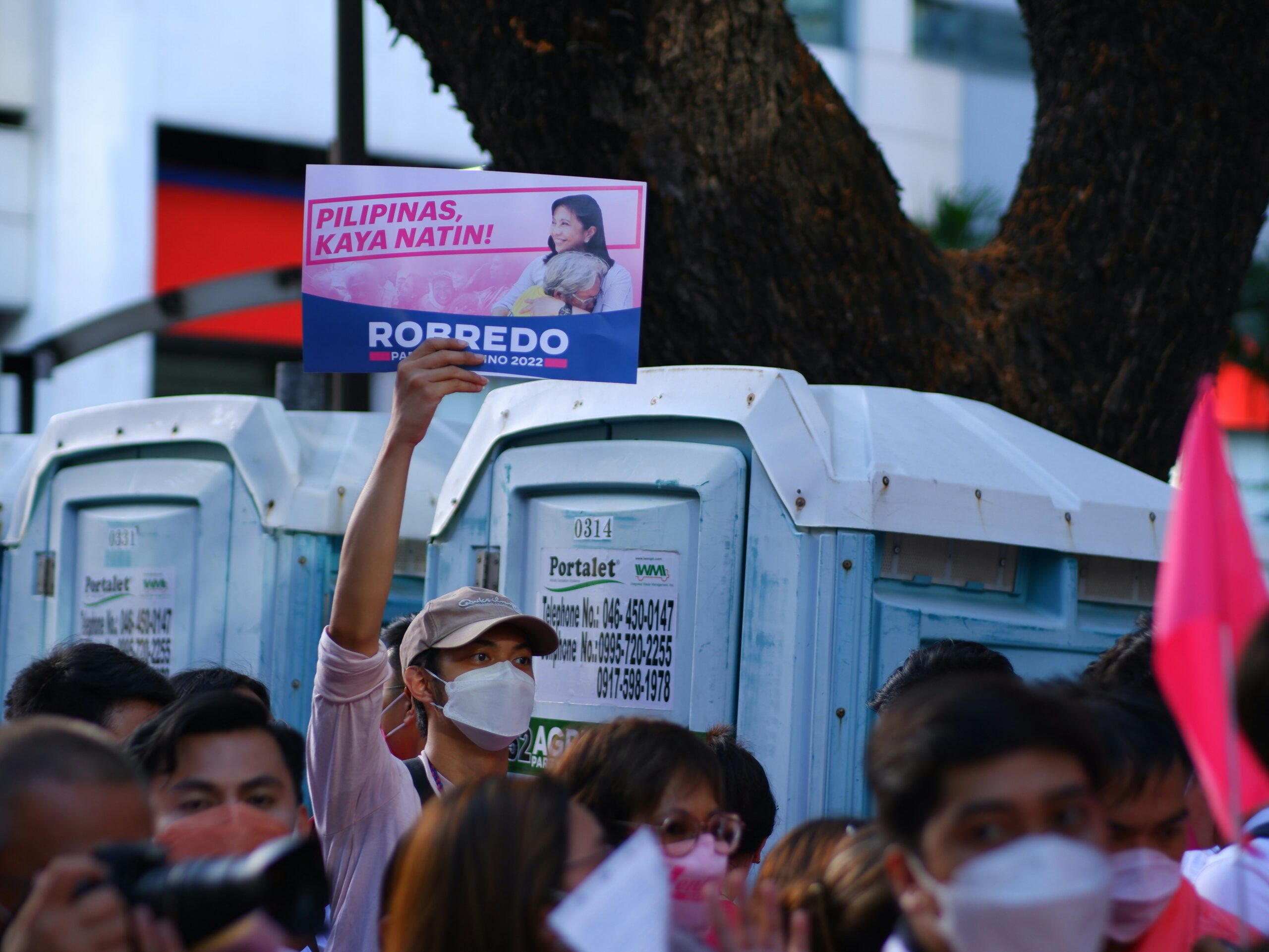 a group of people holding signs