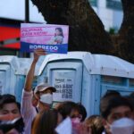 a group of people holding signs